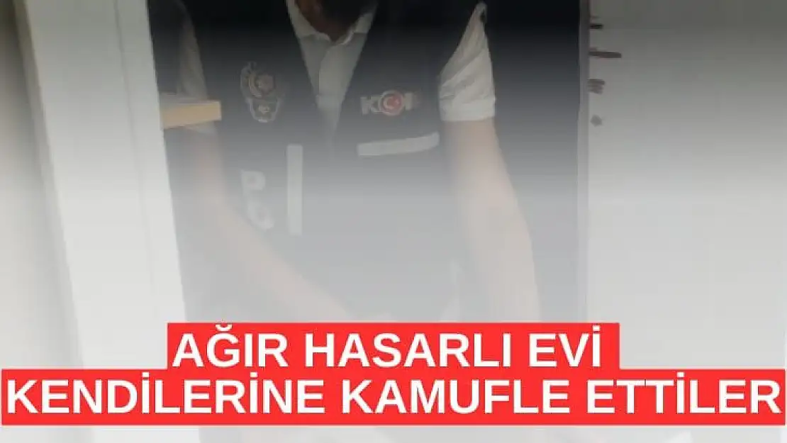 Ağır hasarlı evi kendilerine kamufle ettiler