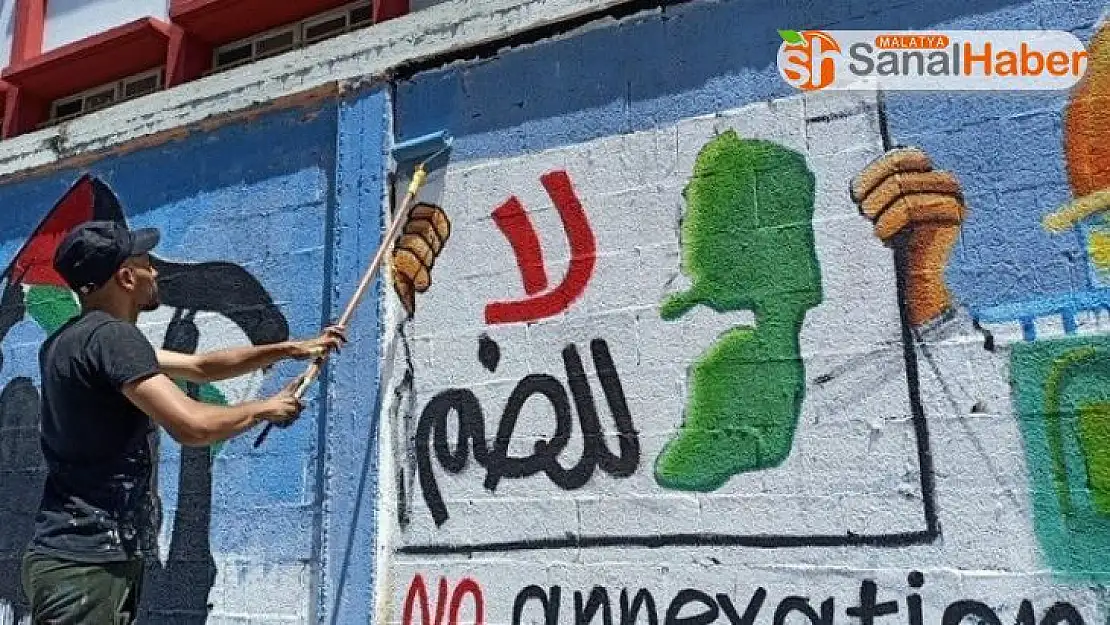 Filistinli gençler, İsrail'in ilhakını grafiti çizerek protesto etti