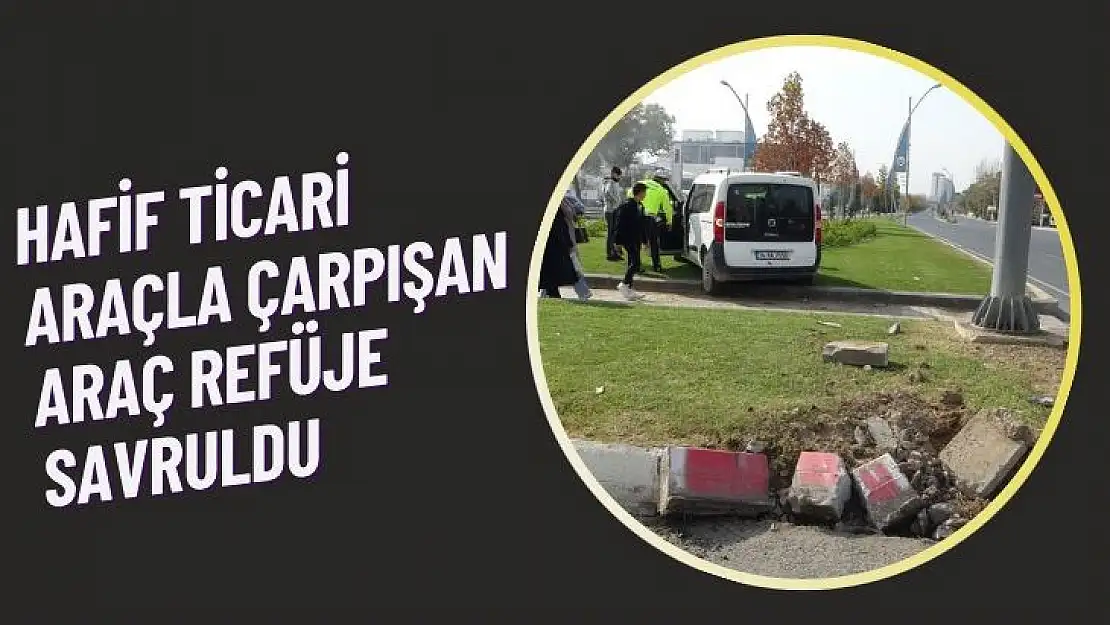 Hafif ticari araçla çarpışan araç refüje savruldu