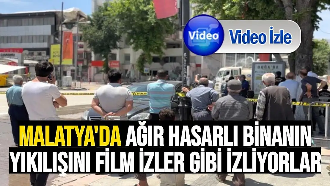 Malatya'da ağır hasarlı binanın yıkılışını film izler gibi izliyorlar