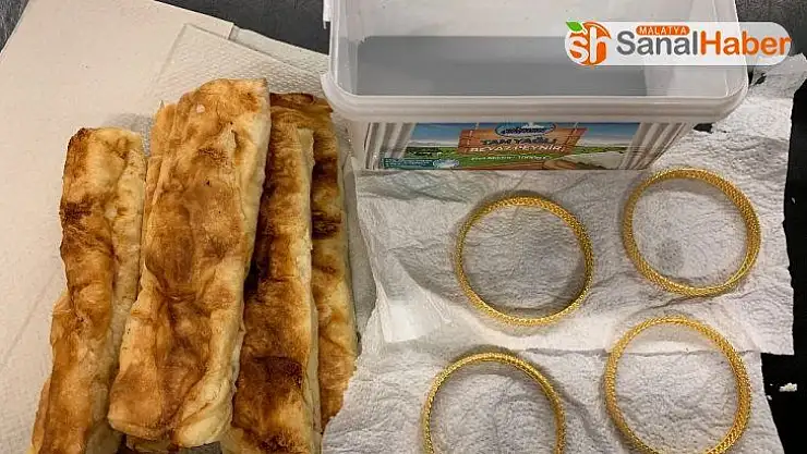 Böreklerin içine altın gizledi, polise yakalandı