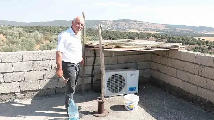 'Sıcaktan arızalanan klima motoruna gölgelik yaptı'