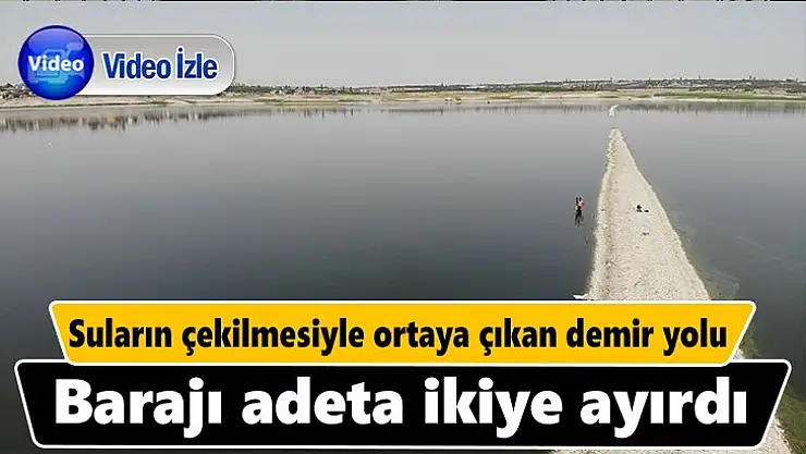 Suların çekilmesiyle ortaya çıkan demir yolu, barajı adeta ikiye ayırdı