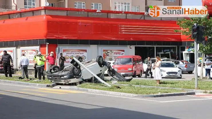 Ters dönen otomobilden burunları bile kanamadan çıktılar